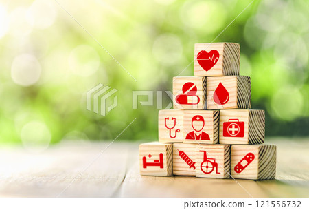 Lay out wooden blocks with icons of medical health. health insurance for your health concept. Healthcare medical business, medical technology equipment icon. Lay out wooden blocks with icons of medical health. health insurance for your health concept. Healthcare medical business, medical technology equipment icon. 121556732