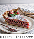 A piece of strawberry pie on a white plate 121557266