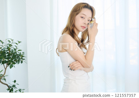 Women wearing make-up water Women wearing make-up water 121557357