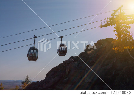 Aerial lift to the mountain in the autumn 121558080