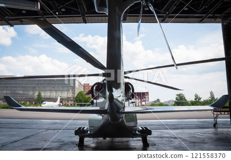 The helicopter is in the hangar. Back view The helicopter is in the hangar. Back view 121558370