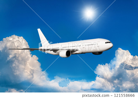 White wide body passenger airliner fly in the air above scenic clouds 121558666