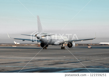 A passenger jet plane run the follow-me-car along the airport apron A passenger jet plane run the follow-me-car along the airport apron 121559251