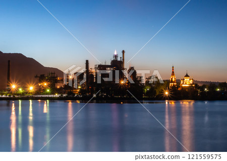 Industrial plant by the lake on a summer night 121559575