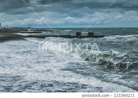 Stormy weather at the seaside. Big waves on the water 121560221