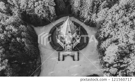 The stunning Schwarzenberg Tomb near Trebon in Czechia is surrounded by lush greenery. Its intricate architecture stands out, showcasing a serene landscape. Black and white photography. 121560717