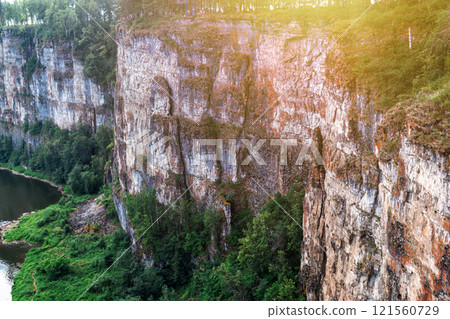 The rocky shore of a picturesque river 121560729