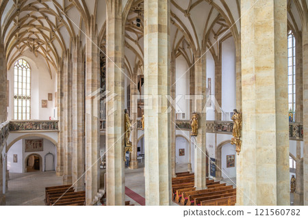 The Church of the Assumption of the Virgin Mary in Most boasts soaring pillars and detailed arches in late Gothic style, highlighting its architectural beauty and serene atmosphere. 121560782