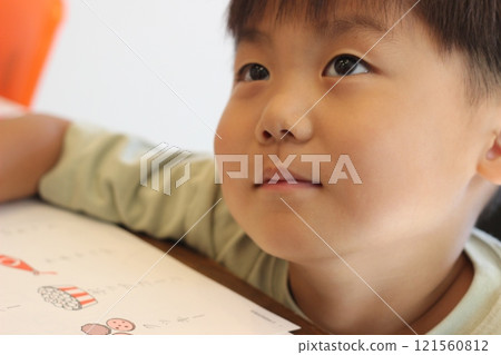 Boy making homework 121560812