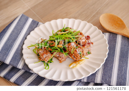Minced meat and pea sprouts stir-fried with oyster sauce Minced meat and pea sprouts stir-fried with oyster sauce 121561178