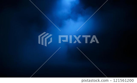 A beam of cold blue spotlight on a dark, empty stage, the room shrouded in a thick layer of blue fog. An abstract combination of smoke textures and lighting 121561200