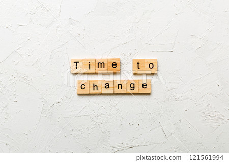 TIME TO CHANGE word written on wood block. TIME TO CHANGE text on table, concept TIME TO CHANGE word written on wood block. TIME TO CHANGE text on table, concept 121561994