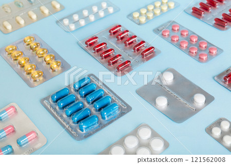 too many different pill of various blisters with different pills Medicines storage at home concept Medication storing. A pile of medicine in blister packs. Pharmaceutical blister packs 121562008