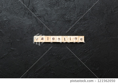 valentine word written on wood block. valentine text on table, concept 121562050
