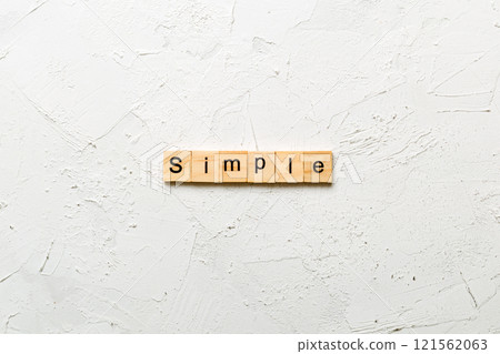 simple word written on wood block. simple text on table, concept simple word written on wood block. simple text on table, concept 121562063