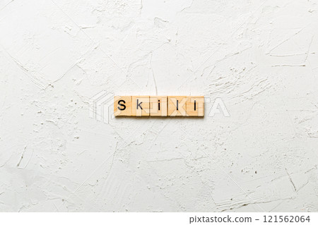 Skill word written on wood block. Skill text on cement table for your desing, concept Skill word written on wood block. Skill text on cement table for your desing, concept 121562064