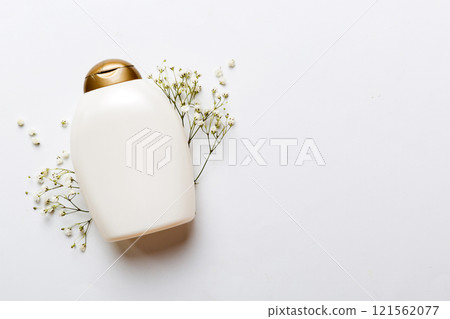 Fancy healthcare bottles for cream with gypsophila branch. Natural oranic spa cosmetics concept. Mockup, template, Top view Fancy healthcare bottles for cream with gypsophila branch. Natural oranic spa cosmetics concept. Mockup, template, Top view 121562077