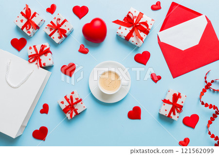 Mug coffee and gift box on colored background. Flat lay composition. Holiday concept 121562099