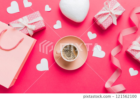 Mug coffee and gift box on colored background. Flat lay composition. Holiday concept 121562100