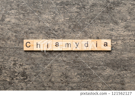 chlamydia word written on wood block. chlamydia text on table, concept 121562127