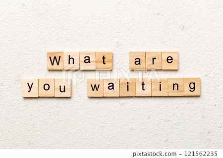 What are you waiting word written on wood block. What are you waiting text on cement table for your desing, Top view concept 121562235