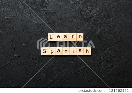 learn spanish word written on wood block. learn spanish text on table, concept learn spanish word written on wood block. learn spanish text on table, concept 121562321