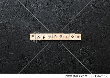 expansion word written on wood block. expansion text on table, concept 121562337