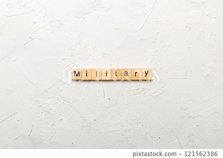 MILITARY word written on wood block. MILITARY text on cement table for your desing, concept MILITARY word written on wood block. MILITARY text on cement table for your desing, concept 121562386