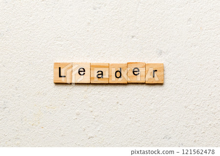 leader word written on wood block. leader text on cement table for your desing, concept leader word written on wood block. leader text on cement table for your desing, concept 121562478