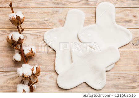 set of colorful bright reusable menstrual pads with cotton flower. zero waste woman periods concept top view with copy space set of colorful bright reusable menstrual pads with cotton flower. zero waste woman periods concept top view with copy space 121562510