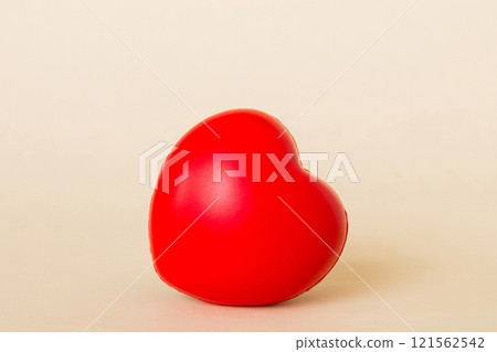 gift box with red bow and red heart on colored background. Perspective view. Flat lay 121562542