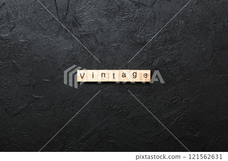 vintage word written on wood block. vintage text on cement table for your desing, concept vintage word written on wood block. vintage text on cement table for your desing, concept 121562631
