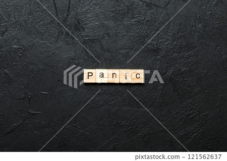 panic word written on wood block. panic text on table, concept 121562637