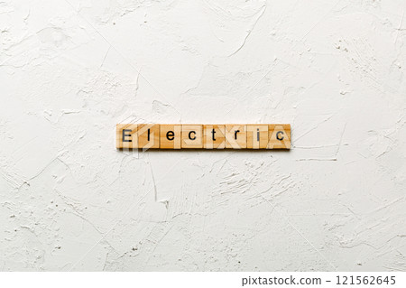 Electric word written on wood block. Electric text on cement table for your desing, concept 121562645