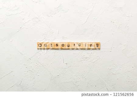outsourcing word written on wood block. outsourcing text on table, concept 121562656