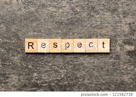 respect word written on wood block. respect text on table, concept 121562738