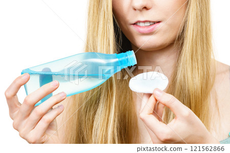 Woman using cleanser cosmetic Woman using cleanser cosmetic 121562866