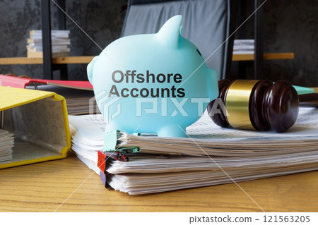 Piggy bank with the phrase offshore accounts. Tax evasion concept 121563205