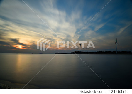 Smooth water surface, sunset at the end of the year 121563563