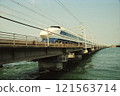100 series double-decker Shinkansen train running over Lake Hamana 121563714