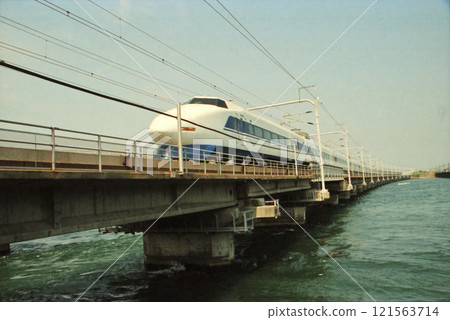 100 series double-decker Shinkansen train running over Lake Hamana 100 series double-decker Shinkansen train running over Lake Hamana 121563714