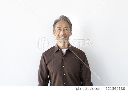 A man in his 60s smiling at the camera 121564188