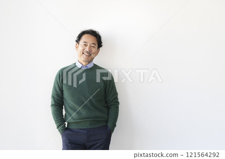 A man in his mid-50s smiling at the camera 121564292