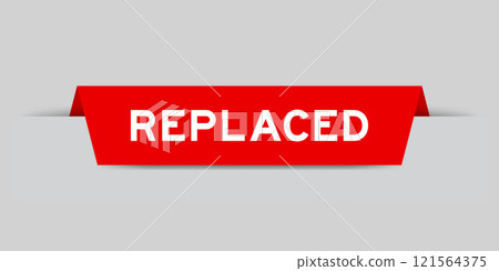 Red color inserted label with word replaced on gray background 121564375