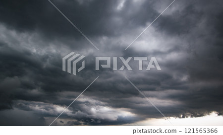 The dark sky with heavy clouds converging and a violent storm before the rain.Bad or moody weather sky and environment. carbon dioxide emissions, greenhouse effect, global warming, climate change The dark sky with heavy clouds converging and a violent storm before the rain.Bad or moody weather sky and environment. carbon dioxide emissions, greenhouse effect, global warming, climate change 121565366