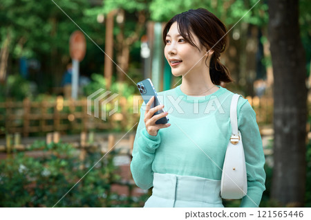 Young woman answering a questionnaire 121565446