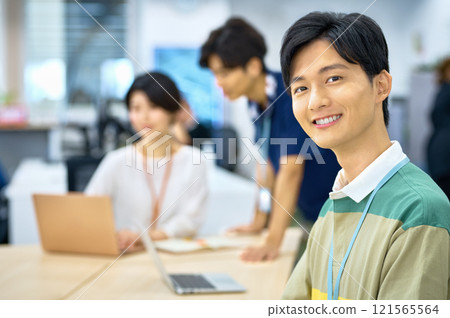 Young IT engineer working in the office 121565564