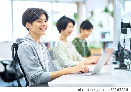 Young IT engineers having a meeting in the office Young IT engineers having a meeting in the office 121565566
