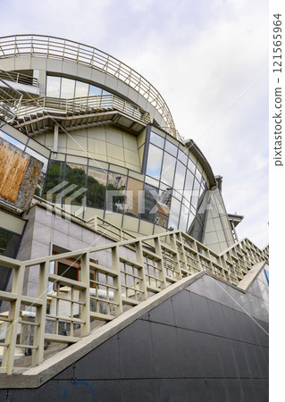 Fragment of a modern building in shape of the national headdress of the Buryats in Ulan-Ude, Russia 121565964