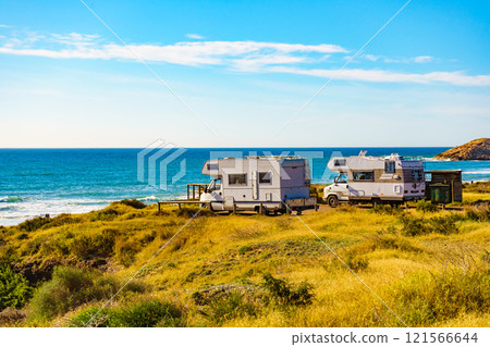 Camper rv camping on sea shore, Spain 121566644